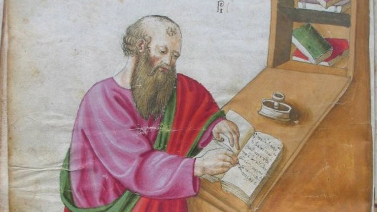 A medieval-looking drawing of a bearded white person in pink and red robs writing in a notebook leaning against a wooden desk