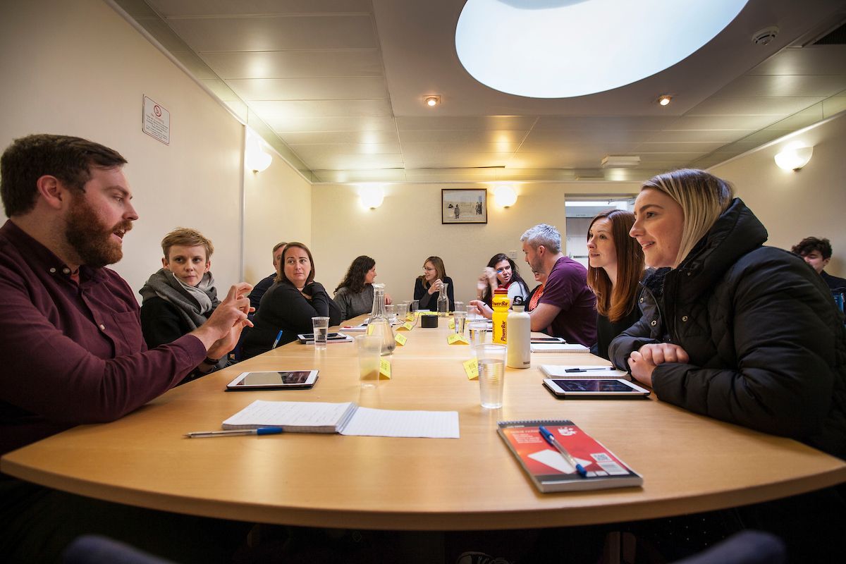 We learnt a lot about how to make immersive theatre through making The Justice Syndicate, where we applied the principle form follows function to arrive at the audience in the roles of jurors. The photo shows player-jurors in the actual jury deliberation room at Dundee Sheriff Court.