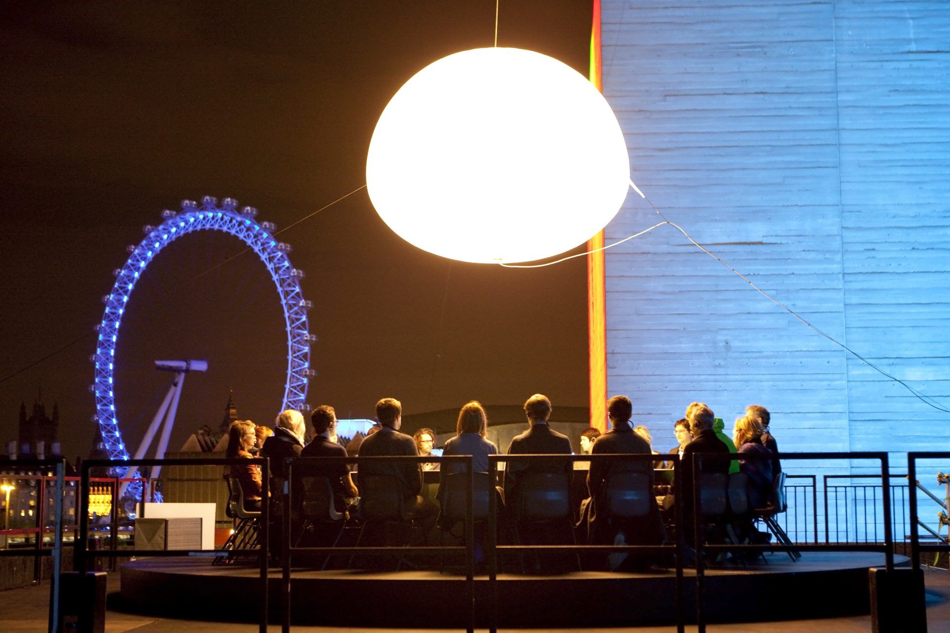 We learnt about the Chaos List from non zero one, who made you’ll see me [sailing in antarctica]. FF use a version of the Chaos List as a way of thinking about the ethics of interactive theatre. In this picture, a group of people sit in a circle on top of a building in London - the London eye is visible behind them. There is a shiny object suspended in the sky above them